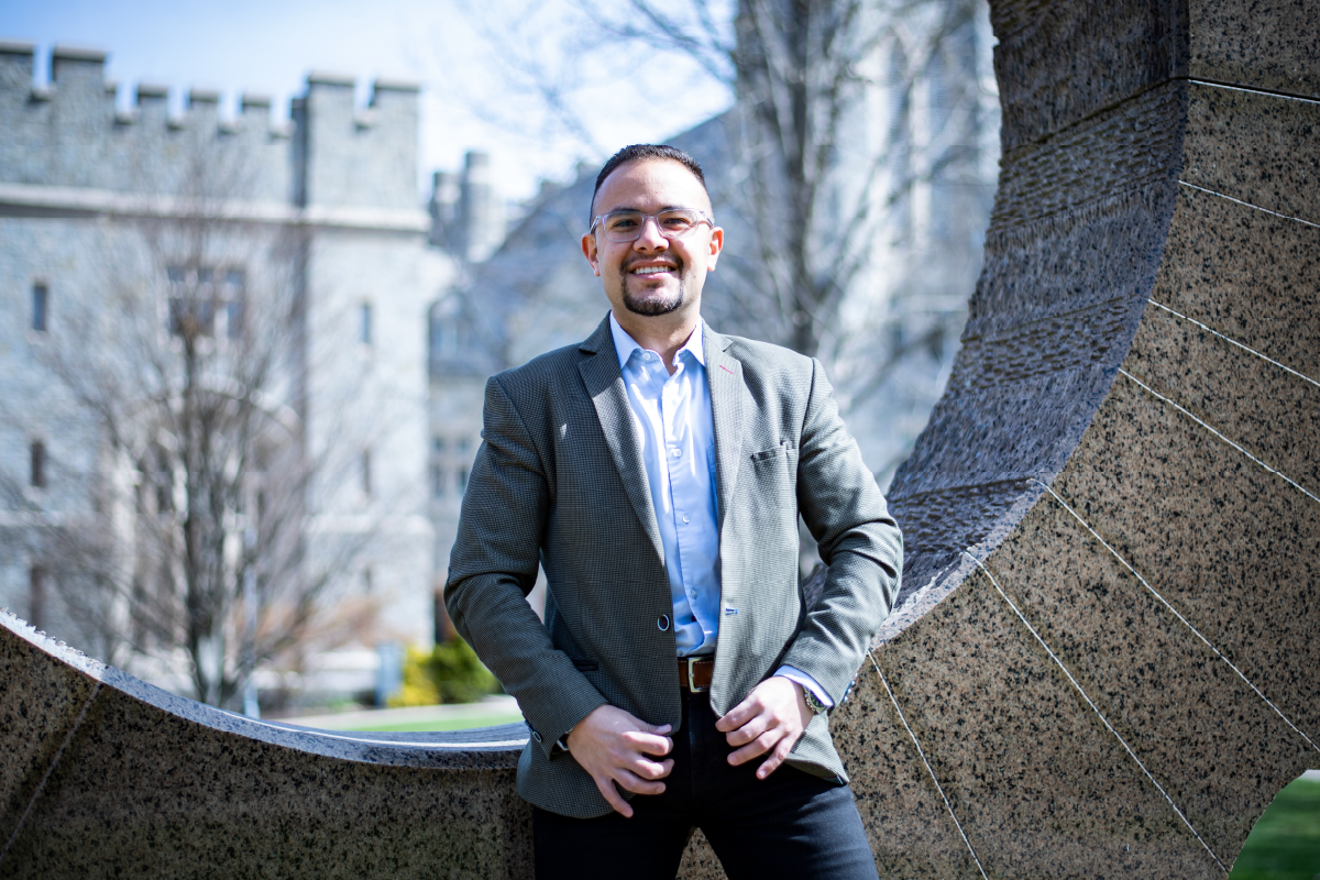 Portrait of Daniel Delgado Jaramillo in front of the Middle Path Sculpture