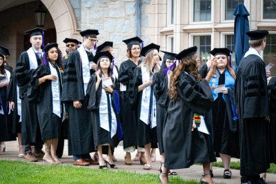 Graduates line up before commencement