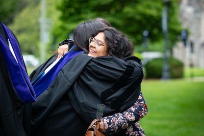 Graduate hugs her friend